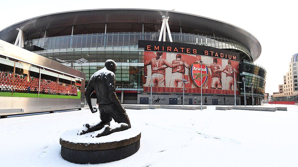 Pictures: Snow falls over Emirates Stadium