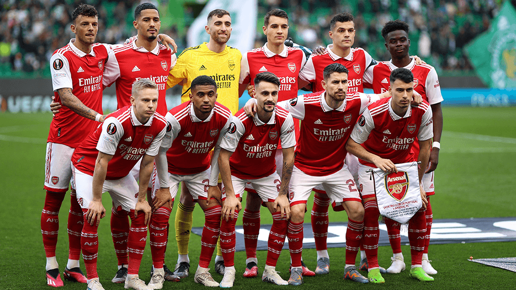 Arsenal line up for a team photo ahead of the game at Sporting