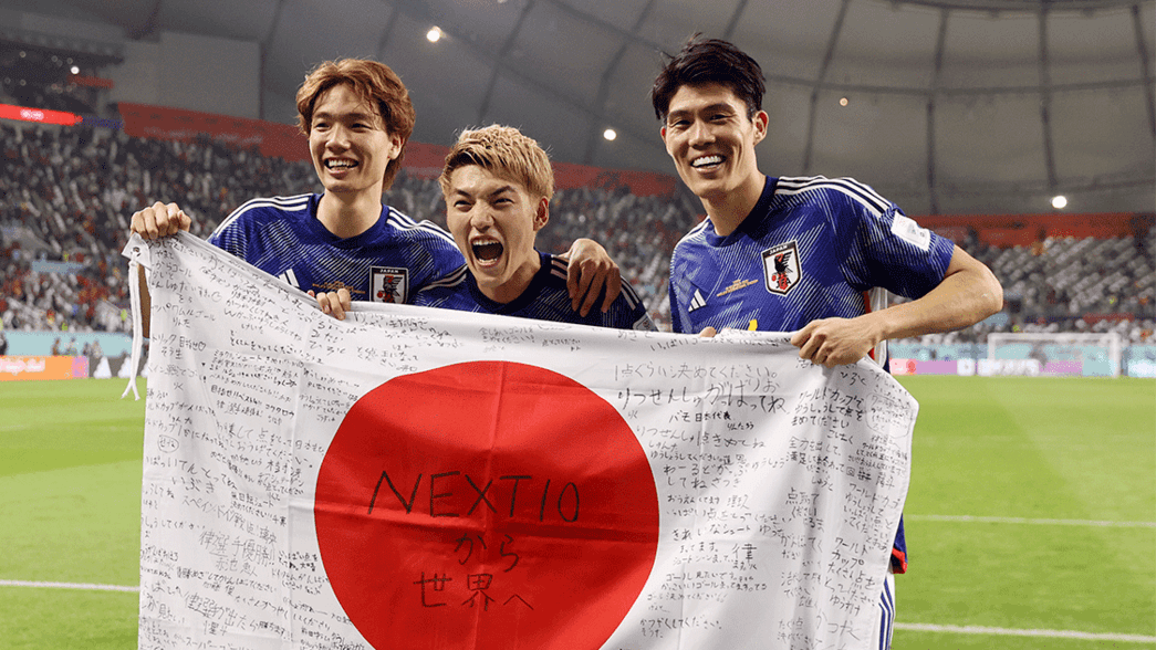 Takehiro Tomiyasu celebrates Japan's win against Spain