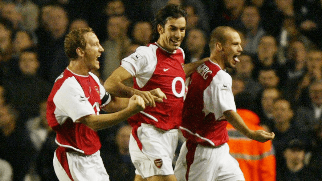 Arsenal celebrate scoring against Tottenham Hotspur in 2003
