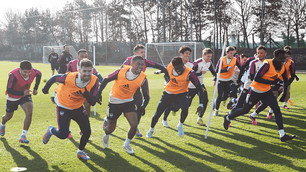 Arsenal men's players undertake some running drills during training