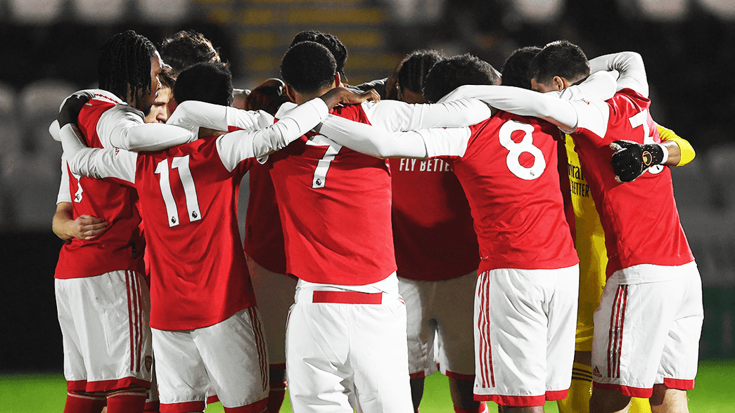 Arsenal's under-18 side in a huddle before their game against Millwall