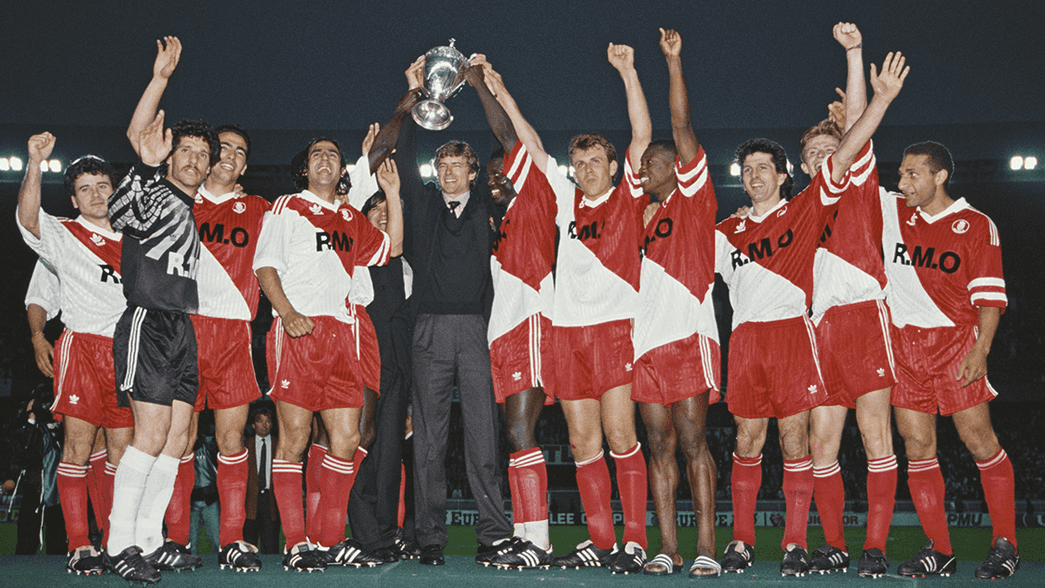 Arsene Wenger lifts the French Cup at Monaco